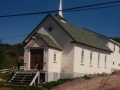 Old Victory Pentecostal Church  stands in front of the New Pentecostal Church at Little Heart's Ease. (Photo  donated by Edith Norris)