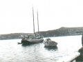 Eldon John Russell with motorboat and punt on Southern Shore. (Photo_Olive Green's Collection