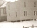house-of-Ralph-and-Floss-Peddle-of-Hodges-Cove-with-their-old-house-behind