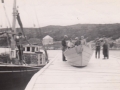The Sid and Sam (schooner) in Hatchet Cove, Joe Hiscock's house in background