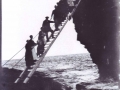 Lighthouse family climbing the ladder stairs dangerous