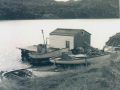 Stage-and-boats-at-Butter-Cove-1970-photo-Decks-Awash