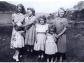 Front L-R Beatrice Green and Marina Green. Back Jessie Banton, Dallas Green, Ruby Green, and Lucy Hiscock taken with St. Jones Head in background . Photo donated by Annie Green.